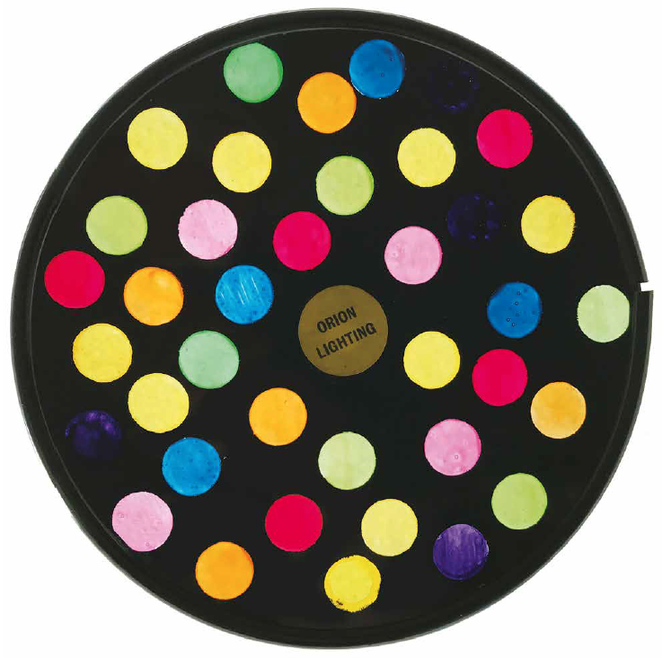 "Snowball," Orion Lighting, 1970s. This wheel was made by sticking circular stickers
to the glass as a mask, spray-painting it black, then removing the stickers with a blade.
The dots were then hand painted on the back of the glass using dyes.